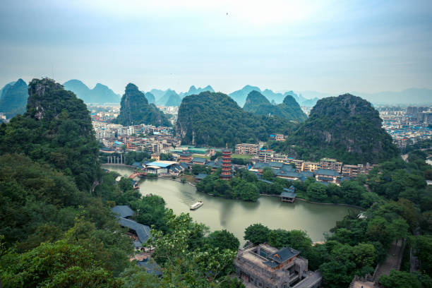 Beautiful impressive karst mountain landscape in Yangshuo before dusk on a sunny hot overcast summer day, Guangxi Province, China