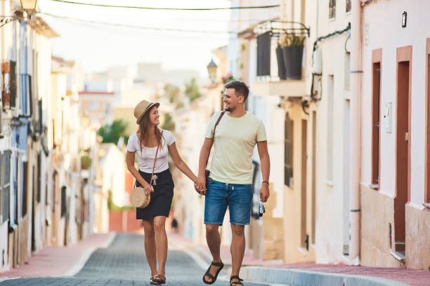 istock Young happy couple walking in Spain 1027093812