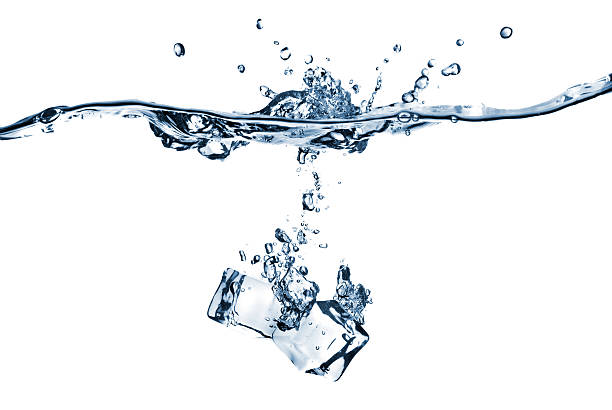 istock ice cubes dropped into water isolated on white 102709617