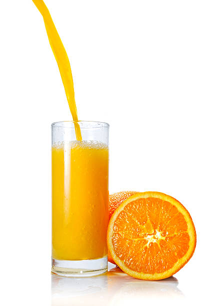 istock Pouring orange juice in glass 102709619