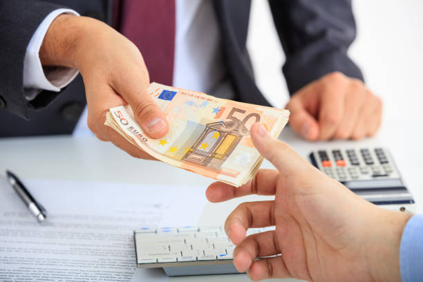 istock Businessman receiving money 1027097432
