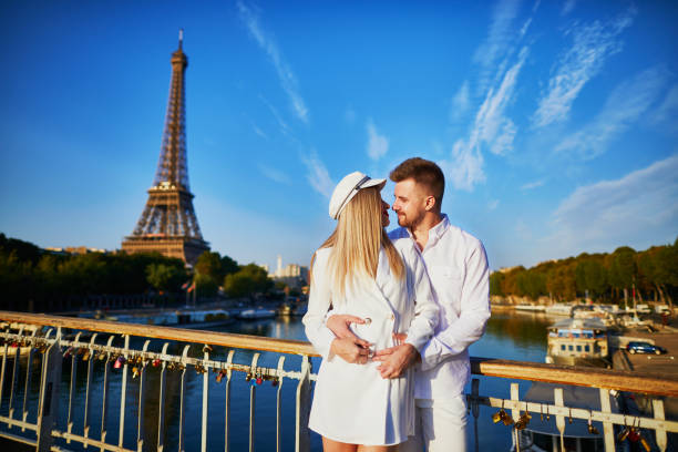 istock Happy couple near the Eiffel tower 1027100858