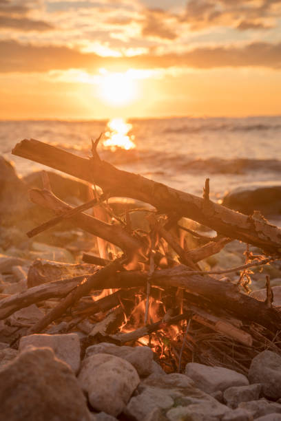 istock fire burns near the sea 1027103960