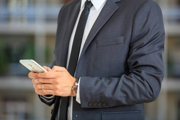 istock Businessman holding a smartphone 1027104466