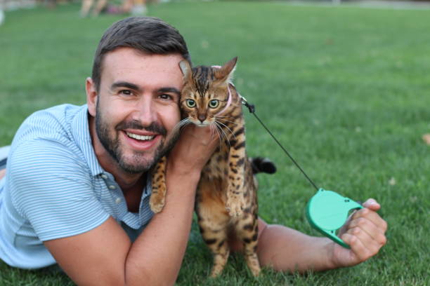 istock Handsome bachelor with his pet outdoors 1027108350