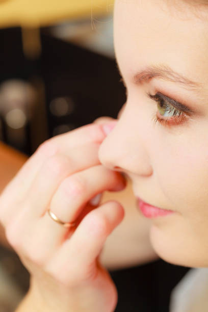 istock Close up woman getting make up, eyeshadow 1027108842
