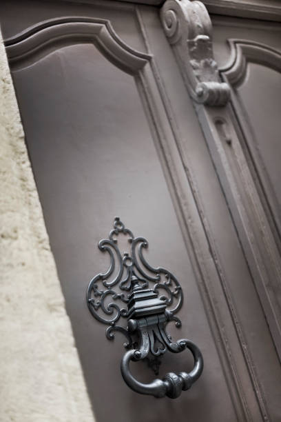 istock Knocker on a wooden door 1027109122
