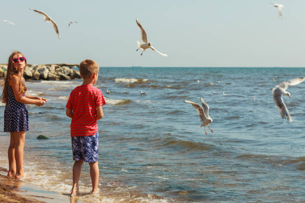 istock Kids playing outdoor on beach. 1027111522