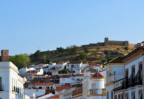 Aracena, Huelva, Andalucía, Spain: Andalusian architecture - white buildings with ceramic tiles and the medieval ramparts