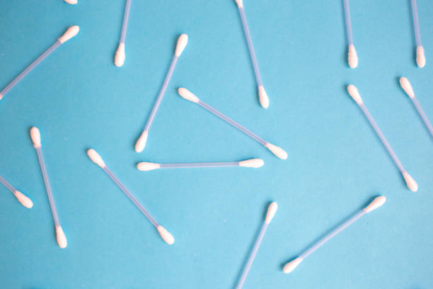 istock the pattern of the cotton buds on a blue background 1027116424