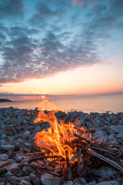 istock fire burns near the sea 1027121026