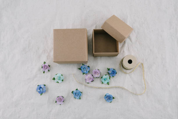 Small dried rose flower on a gift box. Close-up shot.