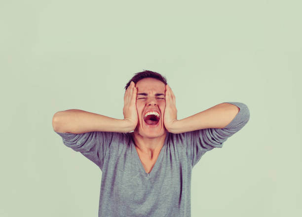 istock unhappy stressed woman hands on head screaming yelling 1027128894