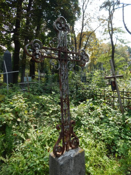 istock Crosses on graves cemetery and fences 1027129208