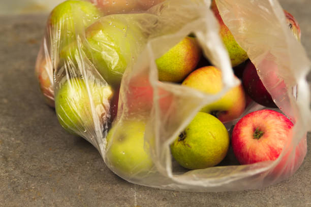 istock Fresh Domestic Apple in Transparent Bag on Table 1027140966