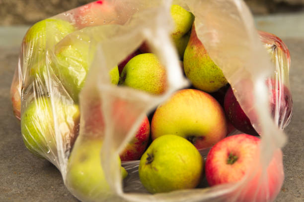 istock Fresh Domestic Apple in Transparent Bag on Table 1027141000
