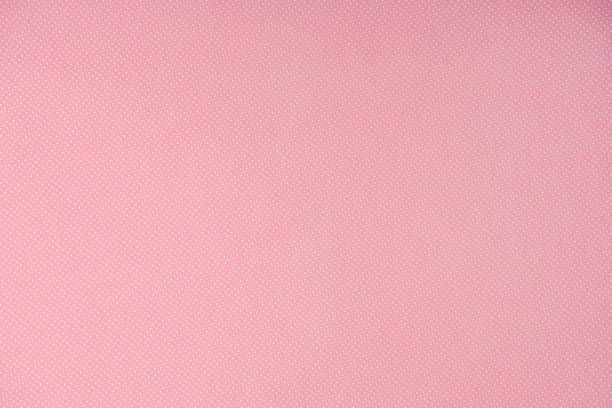 istock top view of white polka dots on pink background 1027145262