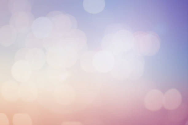 istock blurred beautiful natural pastel background lens ray flare flash light with double exposure of bokeh light 1027148466