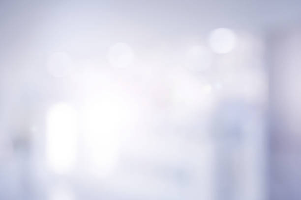 istock abstract blurred gray color with flash light of workplace or hospital corridor background concept. 1027148484