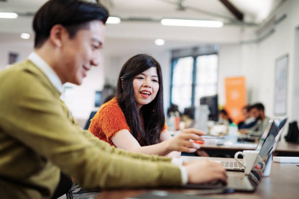 istock Motivated business people in modern office 1027150128