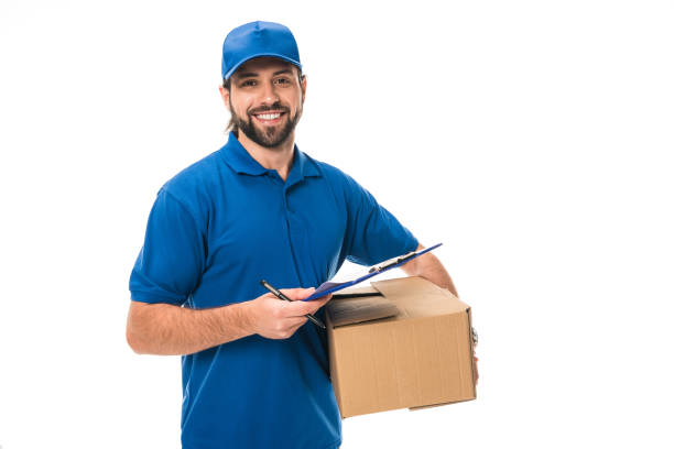 istock happy young delivery man holding clipboard and cardboard box isolated on white 1027154106