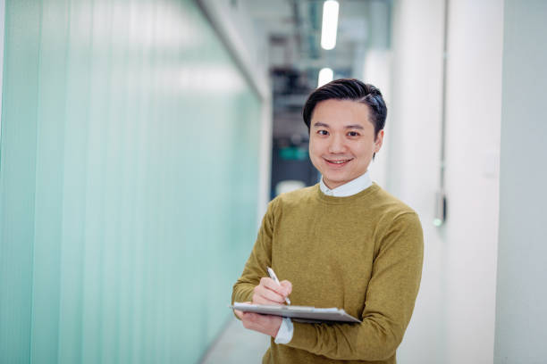 istock Young businessman working in Taiwanese business environment 1027160788
