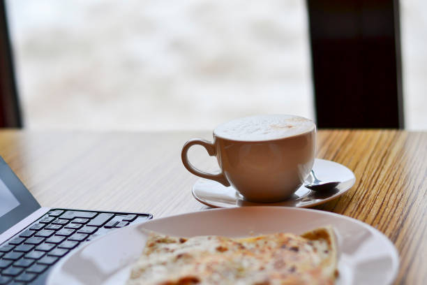 istock lunch at the table with pancakes and coffee at work on the tablet 1027161518
