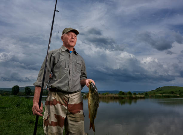 istock senior man relaxing at fishing 1027164840