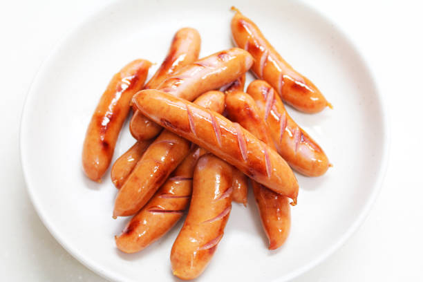 istock Sausage baked on white background 1027168458