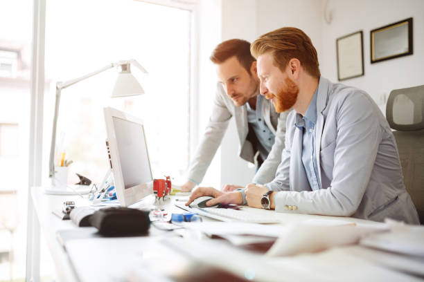 istock Coworkers planning startup goals 1027168914