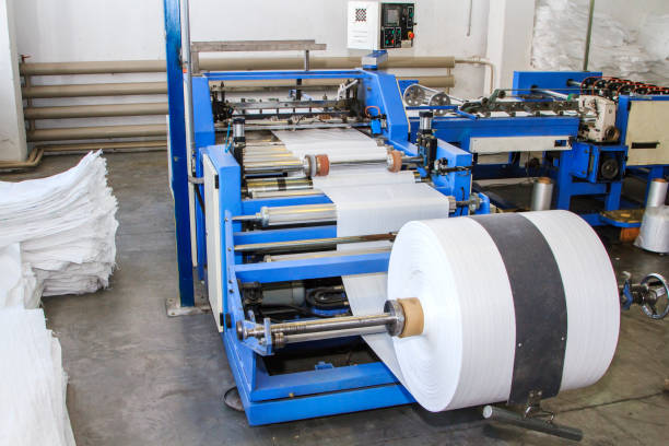istock Big polymeric tape roll unreel for a printing press 1027174556