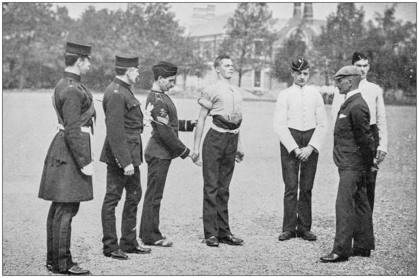 istock Navy and Army antique historical photographs: Measuring a recruit 1027186126