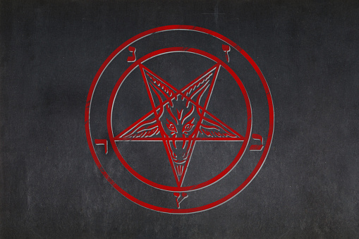 Blackboard with a the Sigil of Baphomet drawn in the middle.