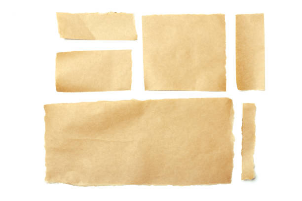 istock brown ripped pieces of paper on white background 1027201596