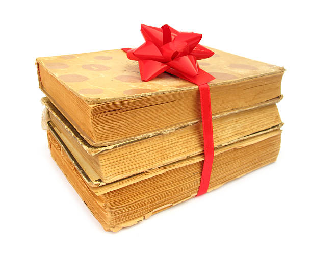 istock Books old vintage packed as gift with red bow 102720264