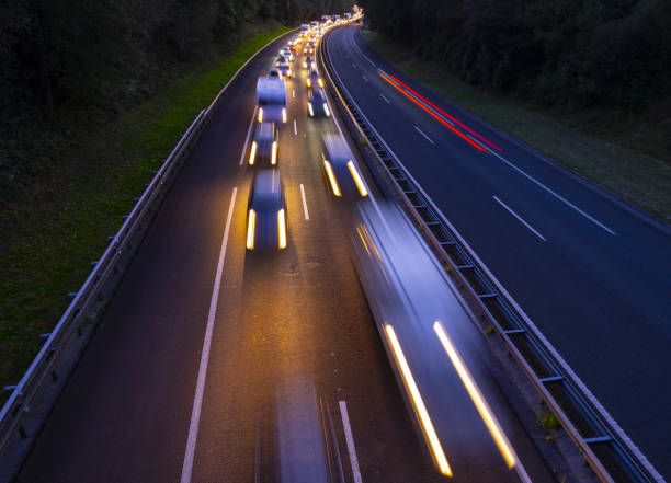 istock Cars on highway in traffic jam at night 1027206126