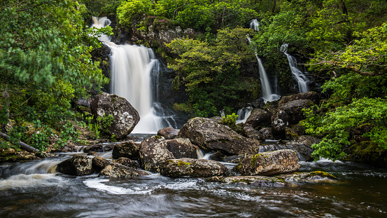 The waterfalls at Inversnaid as they flow into Loch Lomond, the West highland way crosses the bridge above the falls