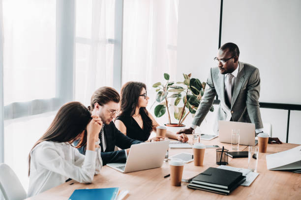 istock multicultural business people having business meeting in office 1027206400