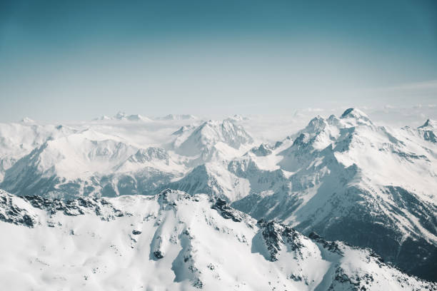 Mountain peaks under snow stock photo