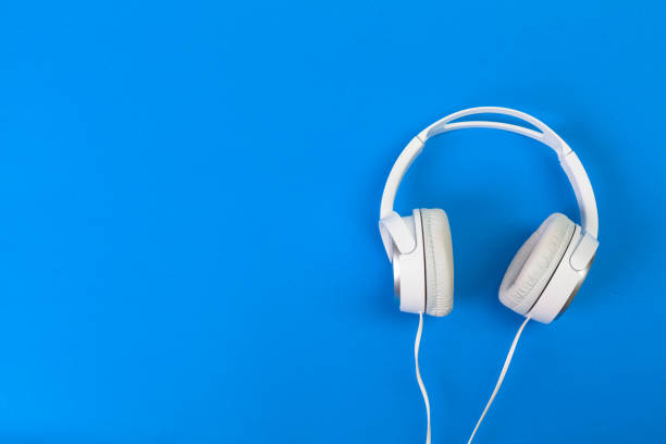 istock Headphones on blue background 1027212034