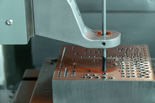 istock The vertical CNC gun-drill machine drilling the mold part . 1027212544