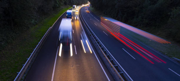 istock Trucks on highway in traffic jam at night 1027214964