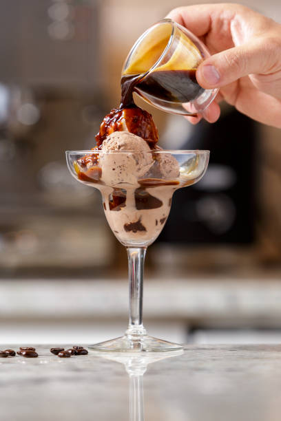 istock Man serving espresso ice cream into the glass 1027215182