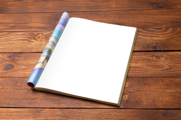 istock Blank book or magazine cover on wood background 1027222404