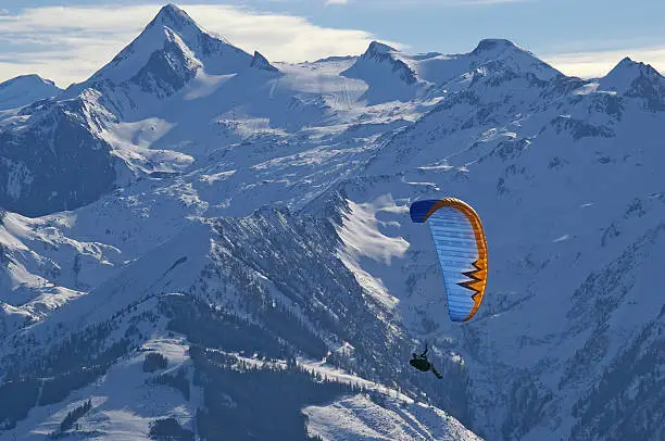 Photo of winter paragliding in alps mountains