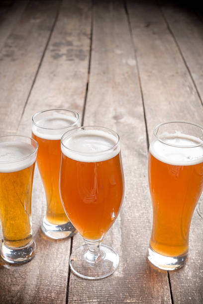 istock glass beer on wood background 1027226984