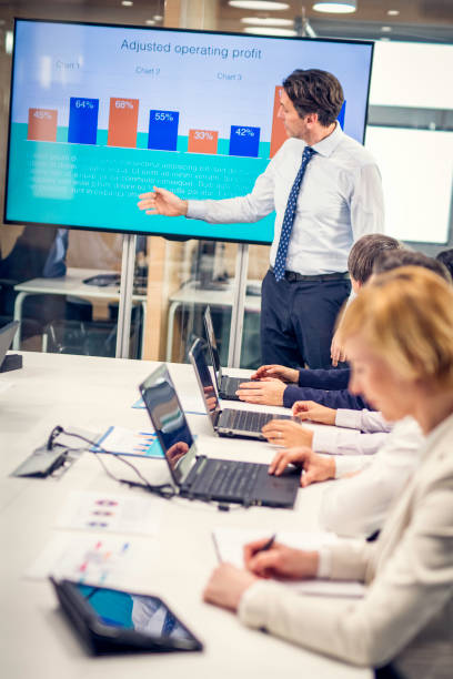 istock Caucasian financial analyst giving a talk to board members 1027228346