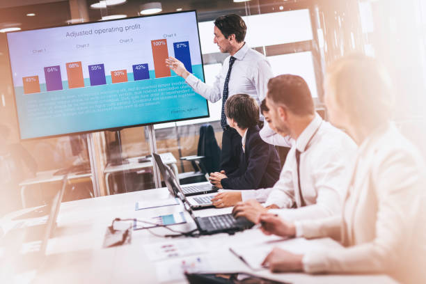 istock Caucasian financial analyst giving a talk to board members 1027228356