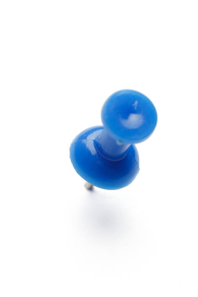 close up of a pushpin on white background