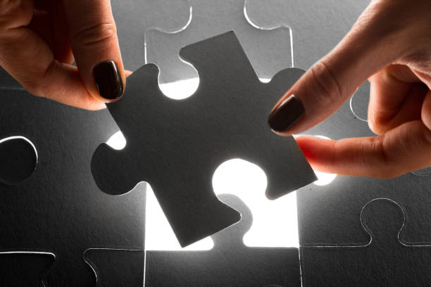 istock Hands holding puzzle pieces, business concept background 1027239270